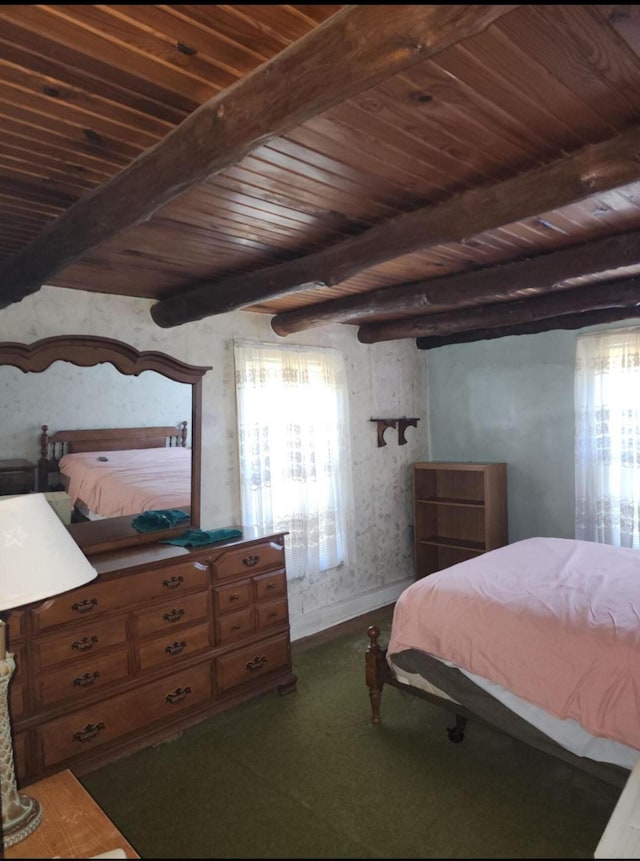 bedroom with beam ceiling and wooden ceiling