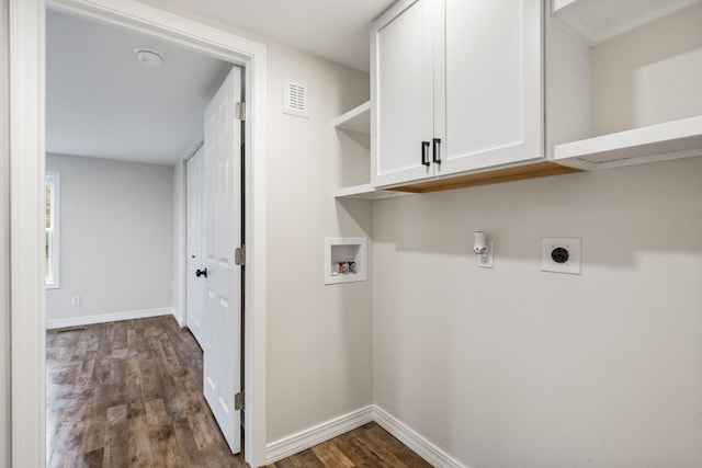 laundry room featuring hookup for an electric dryer, dark hardwood / wood-style flooring, cabinets, and washer hookup