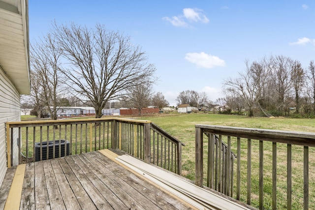 deck featuring a yard and central air condition unit