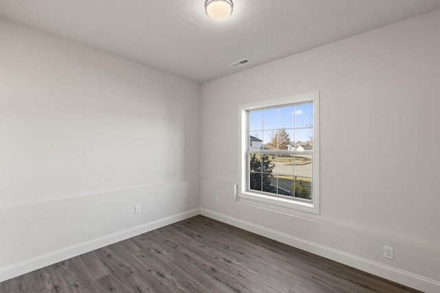 empty room featuring dark hardwood / wood-style floors