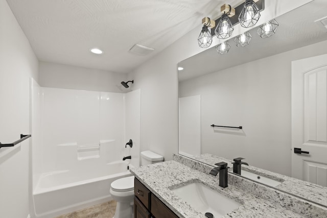 full bathroom with tile patterned flooring, vanity, shower / bath combination, and toilet