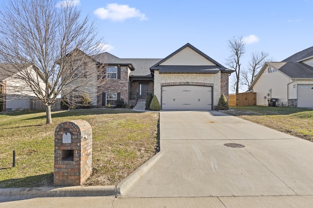 view of front of property featuring a front yard and a garage