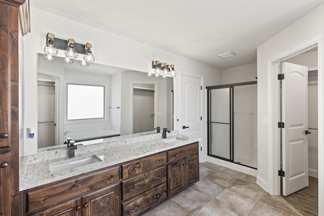 bathroom with vanity and walk in shower