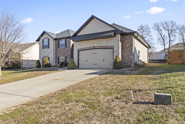 view of front of property featuring a front lawn and a garage