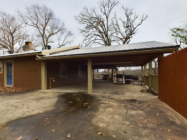 view of vehicle parking featuring a carport