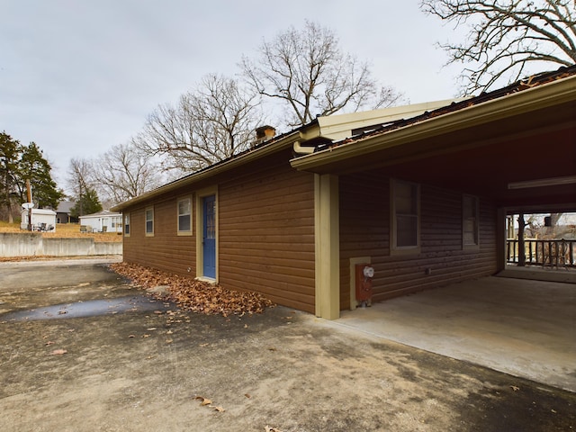 view of home's exterior with a carport