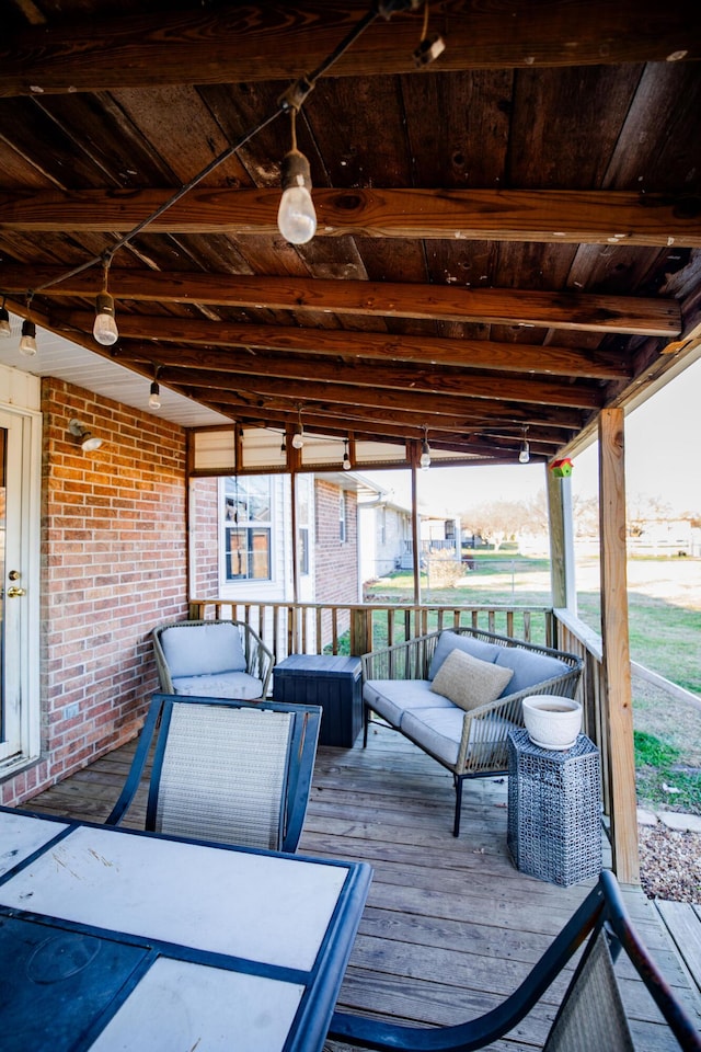 sunroom / solarium with lofted ceiling with beams and wood ceiling