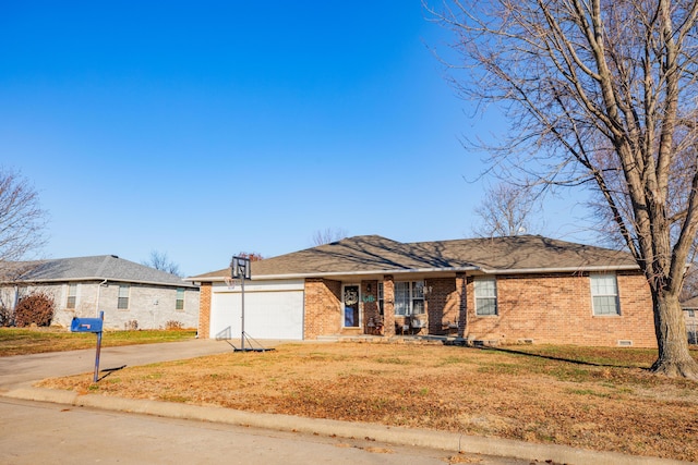 ranch-style house featuring a garage and a front lawn