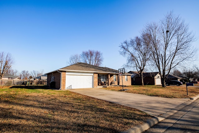 ranch-style house featuring a garage and a front yard