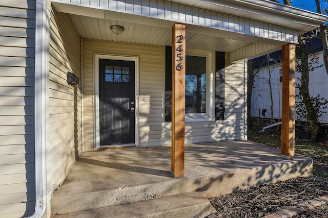 entrance to property featuring a porch