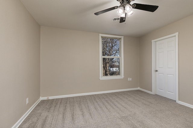 spare room with light carpet and ceiling fan