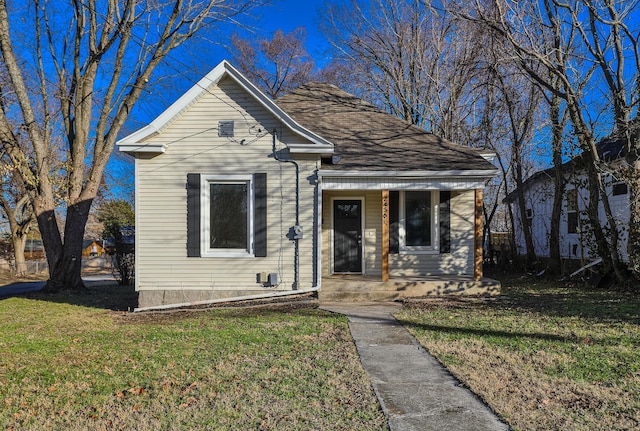 bungalow with a front yard