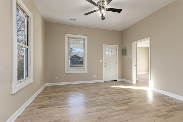 entrance foyer featuring light hardwood / wood-style flooring, a wealth of natural light, and ceiling fan