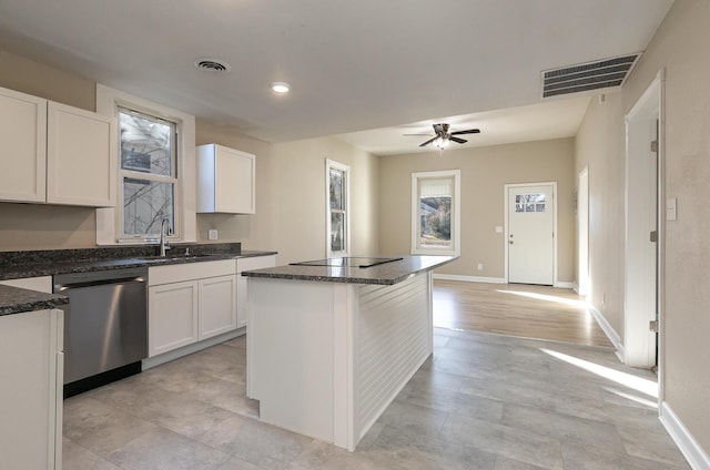 kitchen with white cabinetry, dishwasher, a kitchen island, and sink