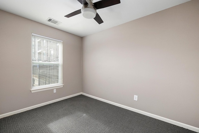 carpeted empty room featuring ceiling fan