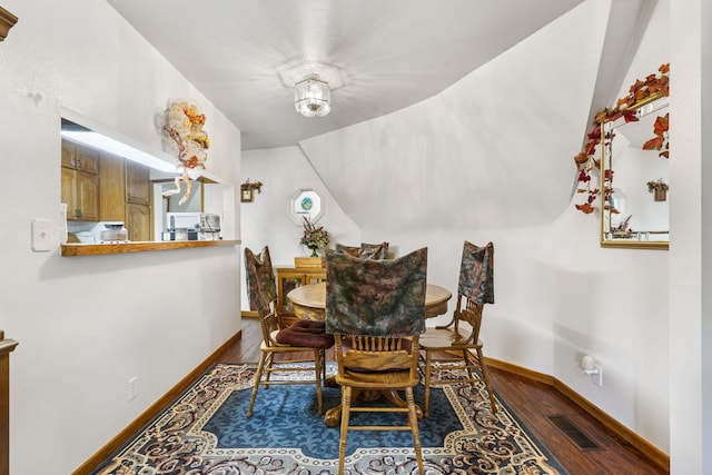 dining space with hardwood / wood-style floors