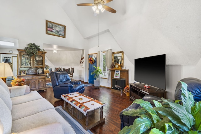 living room featuring ceiling fan, dark hardwood / wood-style flooring, and high vaulted ceiling