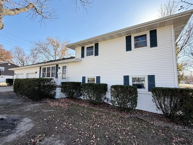 view of side of property with a garage