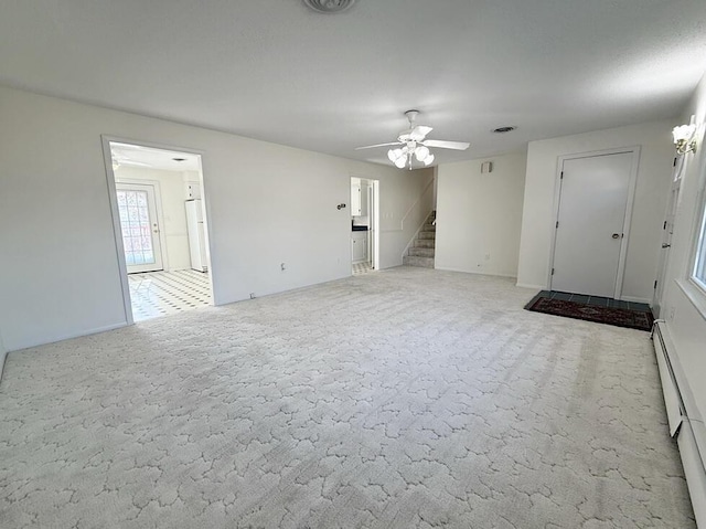 unfurnished living room with light carpet, ceiling fan, and a baseboard heating unit