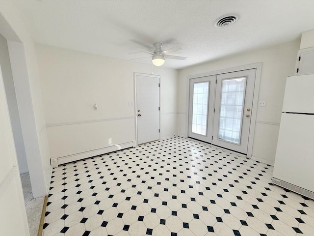 interior space featuring ceiling fan, a textured ceiling, and a baseboard radiator