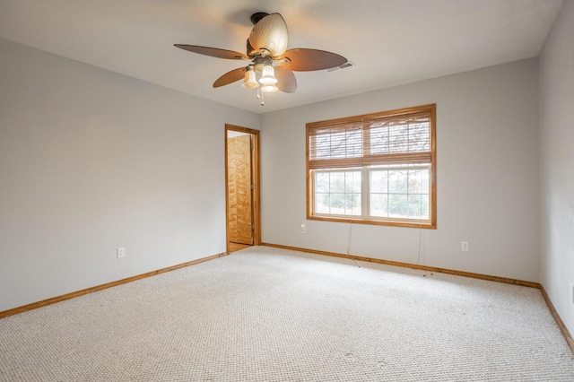 carpeted empty room with ceiling fan