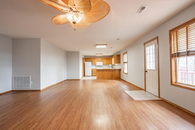 1204 Lake Road Dr, Cassville, MO 65625 - unfurnished living room with light wood finished floors and a ceiling fan