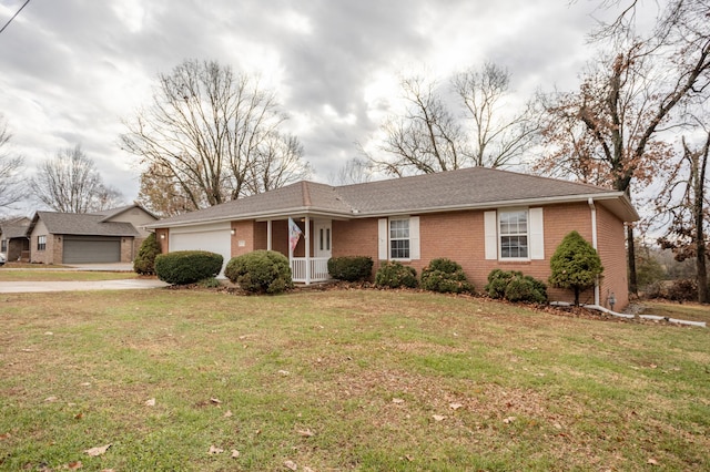 1204 Lake Road Dr, Cassville, MO 65625 - ranch-style home featuring brick siding, an attached garage, a front lawn, and driveway