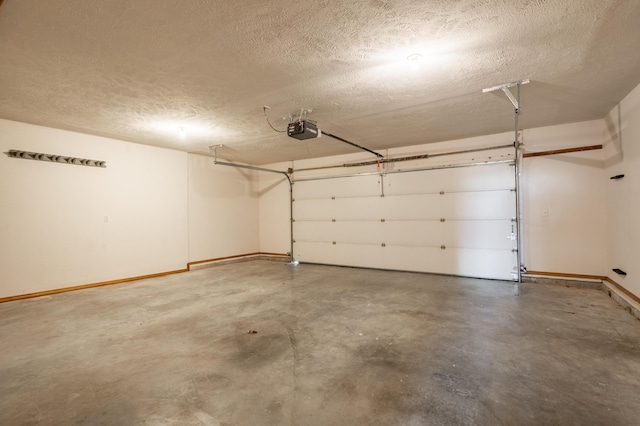 1204 Lake Road Dr, Cassville, MO 65625 - garage with baseboards and a garage door opener