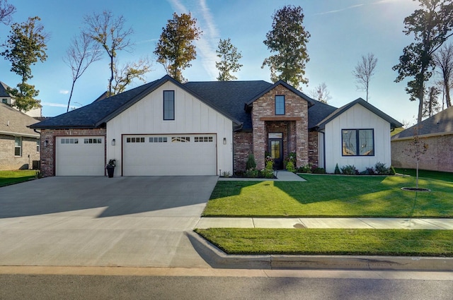 view of front facade with a garage and a front lawn