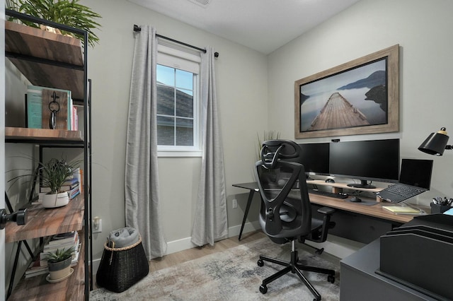 office space with light hardwood / wood-style floors