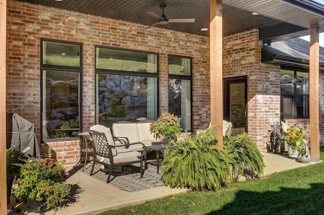 view of patio / terrace with ceiling fan and an outdoor living space