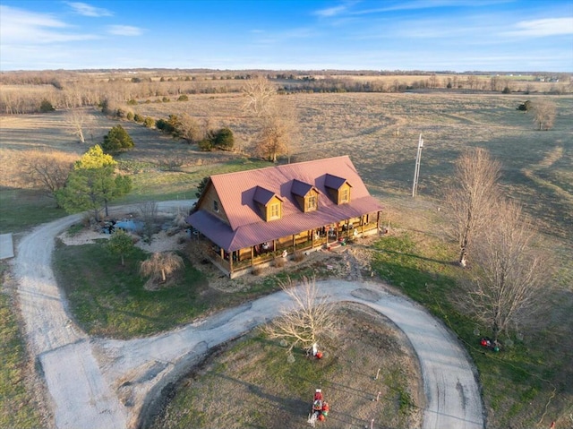 birds eye view of property with a rural view