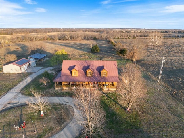 birds eye view of property featuring a rural view