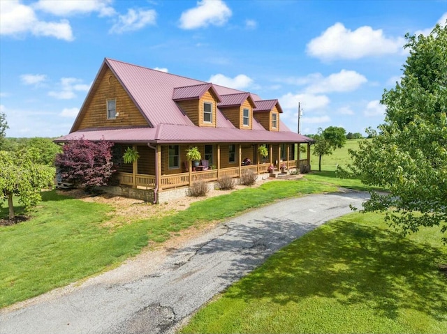 view of front facade featuring covered porch and a front yard