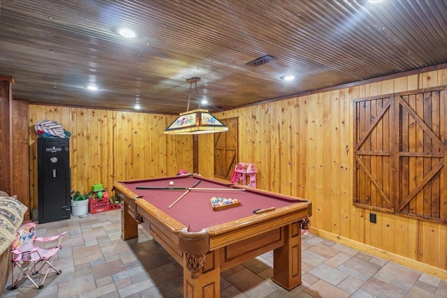 playroom featuring wood walls and pool table