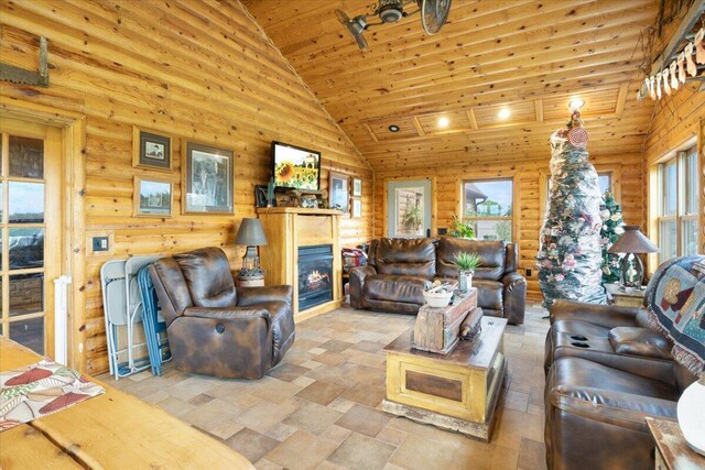 living room with high vaulted ceiling and wood ceiling