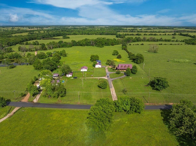 birds eye view of property featuring a rural view