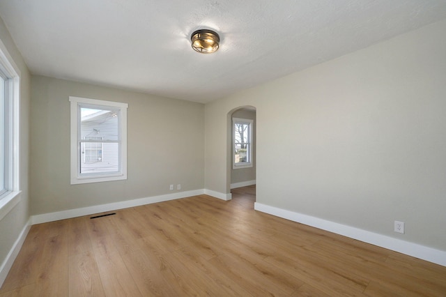 spare room with light hardwood / wood-style floors