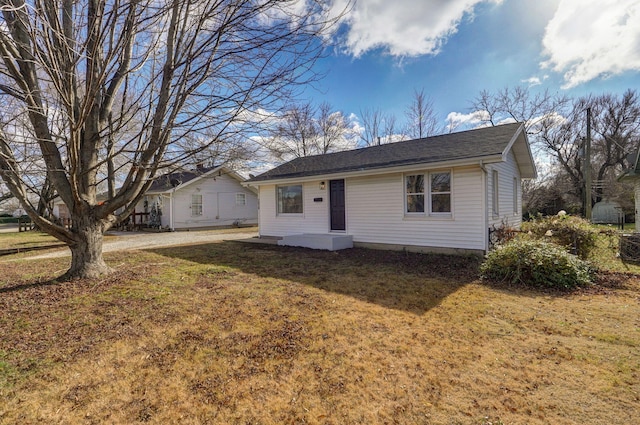 ranch-style home with a front yard