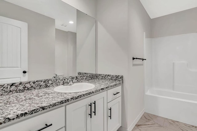 bathroom with visible vents, baseboards, shower / bathing tub combination, marble finish floor, and vanity