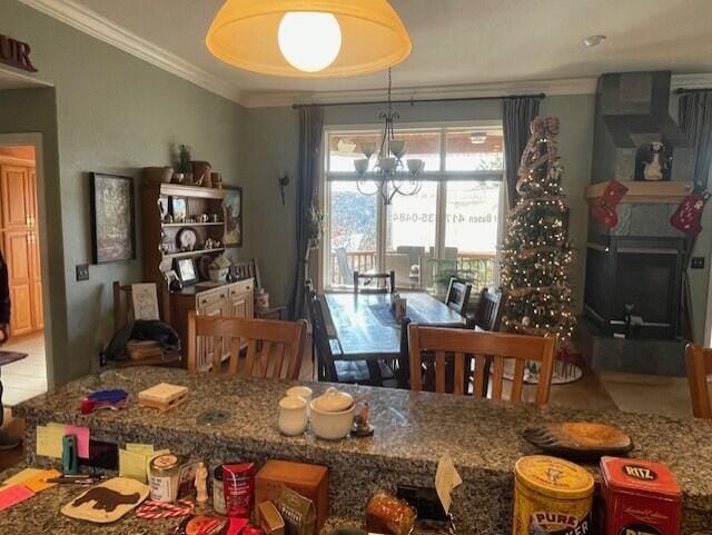 dining area with an inviting chandelier and crown molding