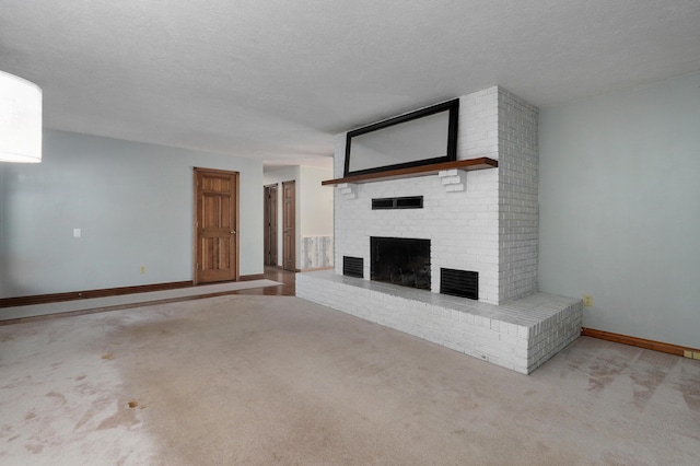 unfurnished living room featuring a textured ceiling, a fireplace, and light carpet