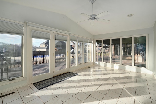 unfurnished sunroom featuring ceiling fan and lofted ceiling