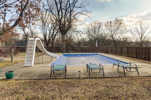 view of swimming pool with a water slide