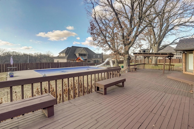 wooden deck with a covered pool