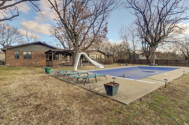 view of swimming pool with a water slide