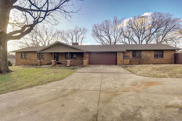 ranch-style home with a front yard and a garage