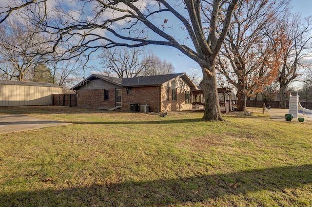 view of yard featuring an outbuilding and central AC