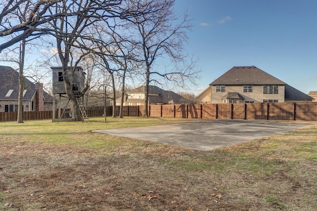 view of yard with basketball court