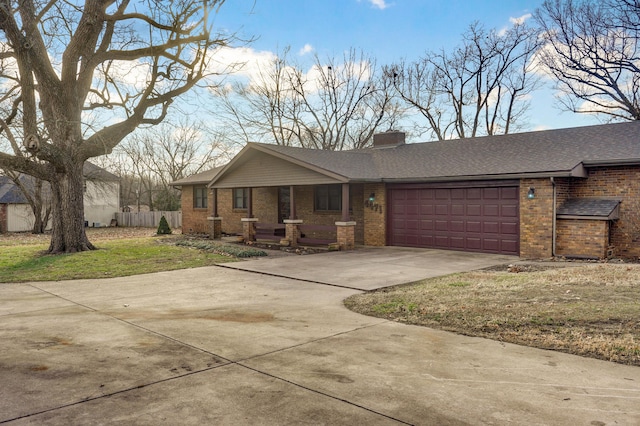 view of front of home featuring a front yard and a garage